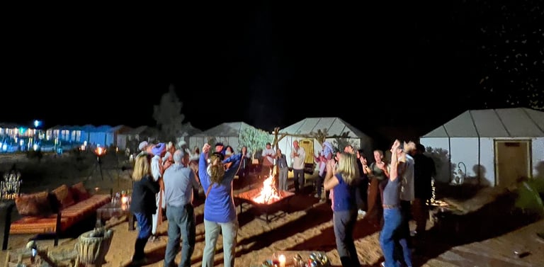 Sahara desert safari camp Morocco tours dancing in the desert