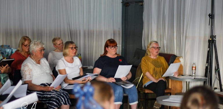 Choir members in rehearsal