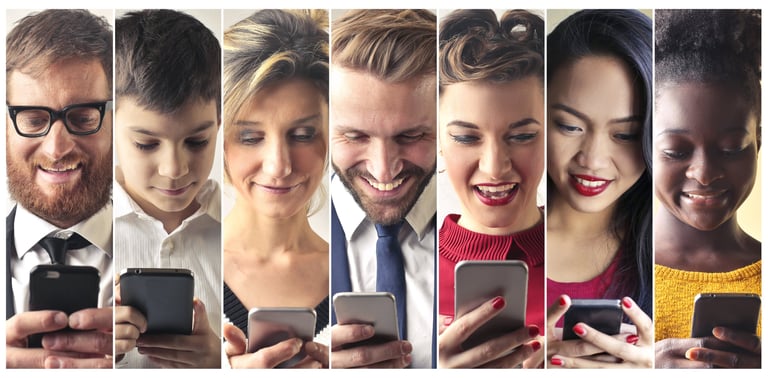 a group of people are looking at their cell phones