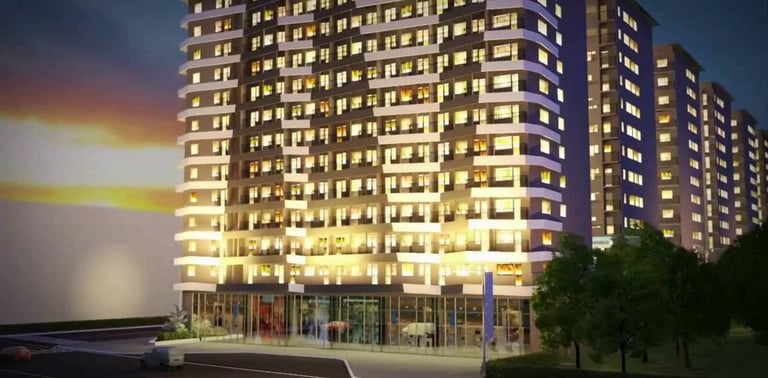 a tall building with a lot of windows and a car parked in front of it