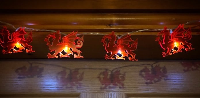 Red dragon lights projecting red dragon shadows behind