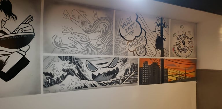 Anime style images on the wall of a restaurant.