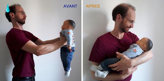 père portant son bébé dans les bras