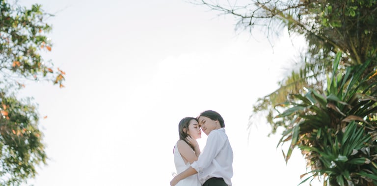 Backlit intimate couple embrace during a photography session at Novotel Bali Benoa in Tanjung Benoa Bali.