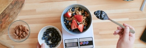 a person is using a food scale