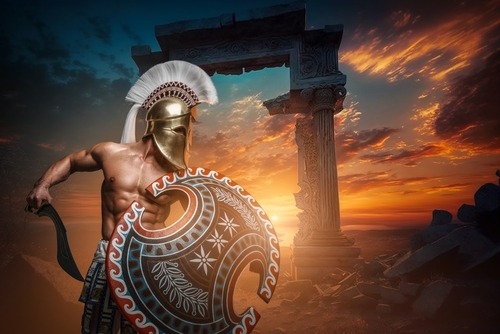 Spartan warrior in golden helmet and shield standing before ancient Greek ruins at sunset.