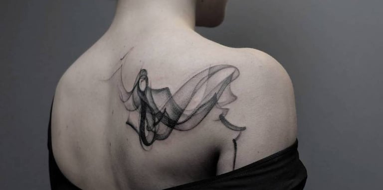 a woman with a tattoo on her back