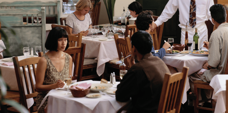 People sitting in a restaurant to connote restaurant AI