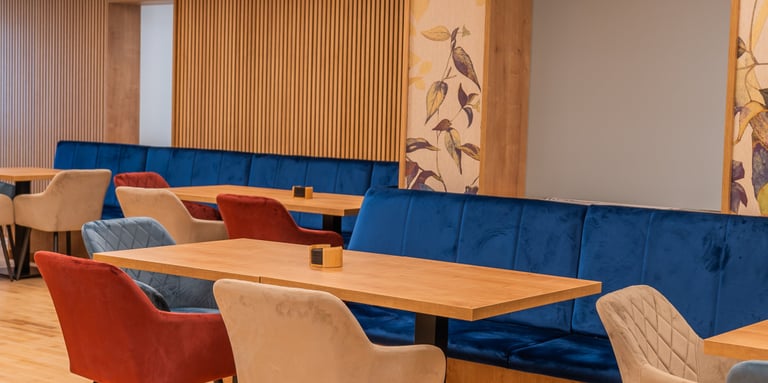 a restaurant with a long table and chairs