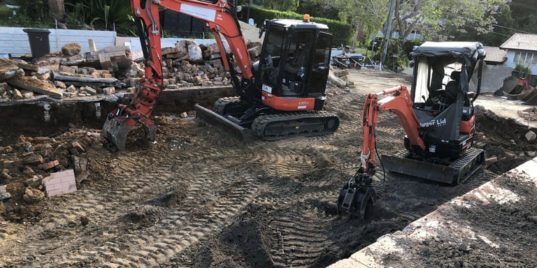 Removal of concrete strip footings.