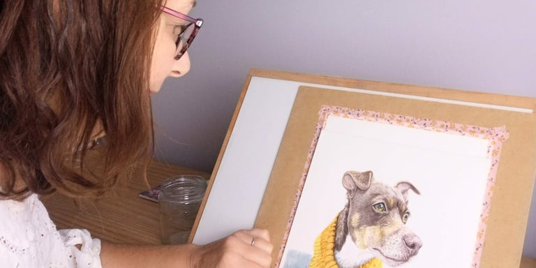 Artist painting a pet portrait in her studio