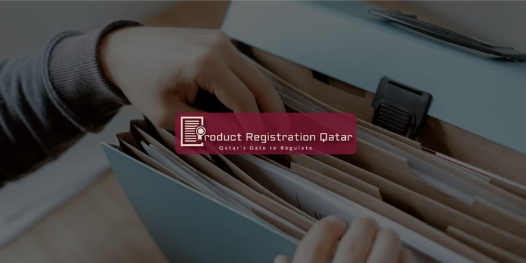 Organizing product registration documents in file folders for MoPH submission with Product Registration Qatar branding.