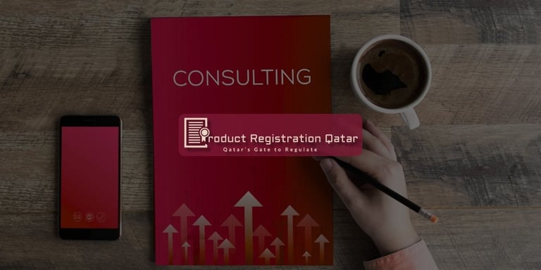 Regulatory consulting Qatar notebook with coffee and Product Registration Qatar logo.