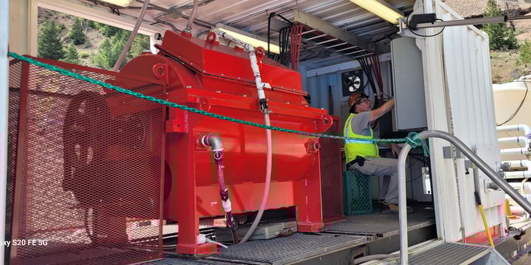 An Avivid team member sitting near the Turbocoag, working on the Nelson Tunnel site in CO.