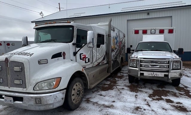 Two of our ambulances at our shop including the "Monster" Kenworth ambulance