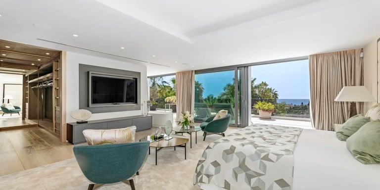 Elegant suite with seating and terrace at Villa Serenity