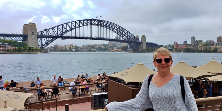 Lady Michelle in front of the Sydney Harbor Bridge in Australia