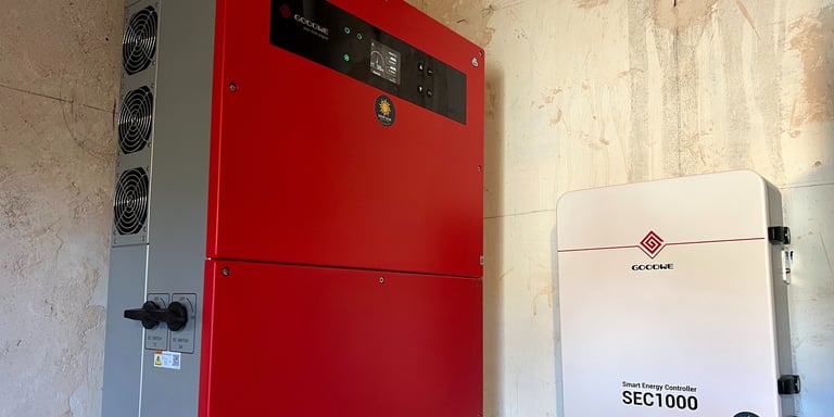 a red and white electric generator unit with a red and black electrical device