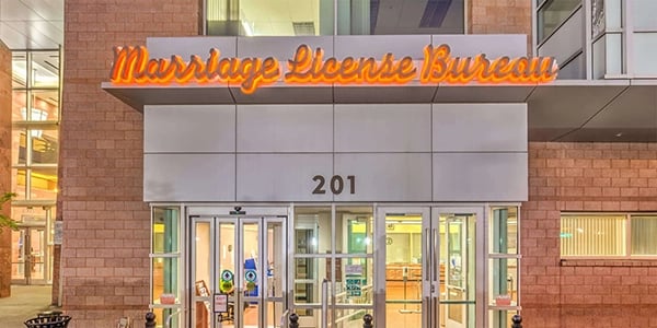 a building with a sign that says marriage license bureau
