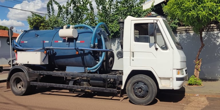 a truck with a tankless water tank sitting on the side of a road