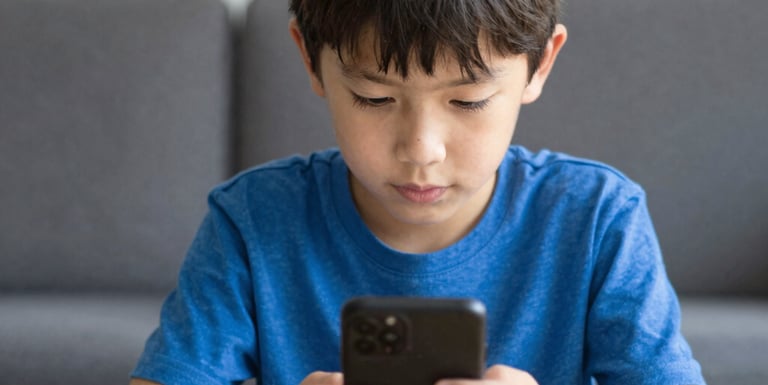 Colorful children happily engaged in hands-on learning activities at a bright table.
