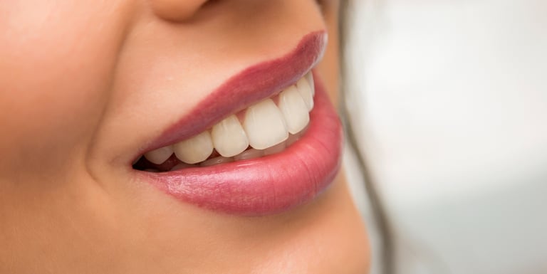 A woman with a toothbrush and a toothbrush in her mouth
