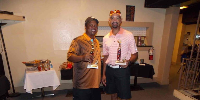Sickle Cell Disease Association of EscaRosa: image of two winner from the golf tournament.