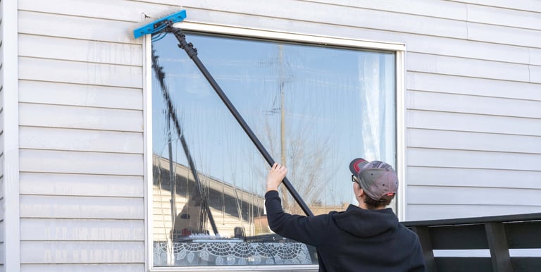 Person washing a window