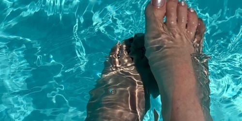 a person's feet in the water