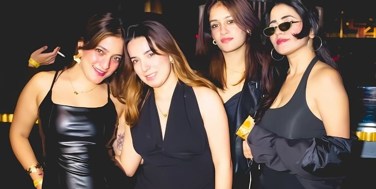 a group of women in black dresses standing in a row