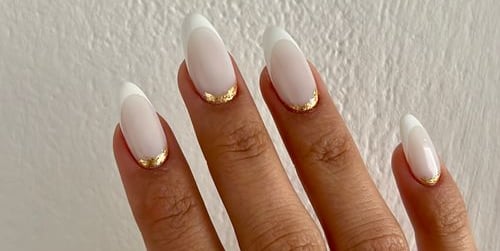 a woman's hand with a white manicured manicured manicured manicured