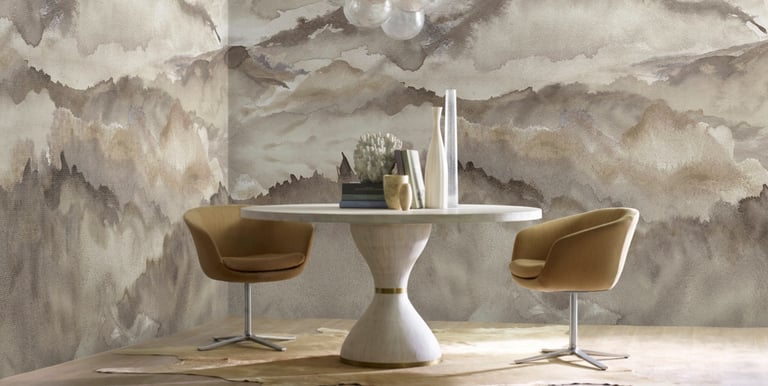 Modern dining room featuring mountain landscape wallpaper, bubble chandelier, and pedestal table.