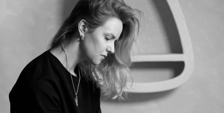 a woman sitting on a chair in a chair