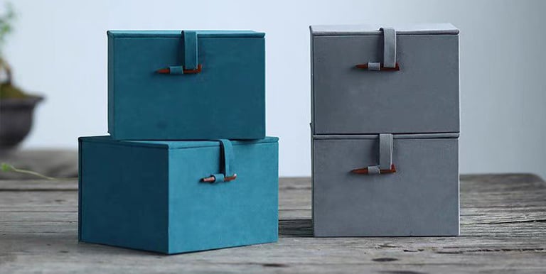 Four gift boxes arranged on a table.