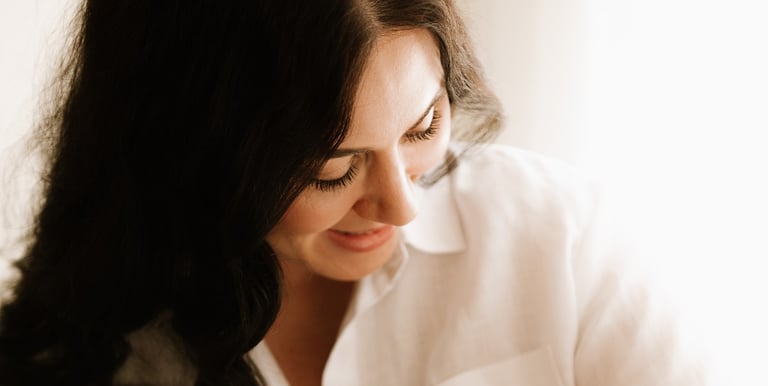 Tender moment between baby and parents, part of a newborn lifestyle photography session in Adelaide