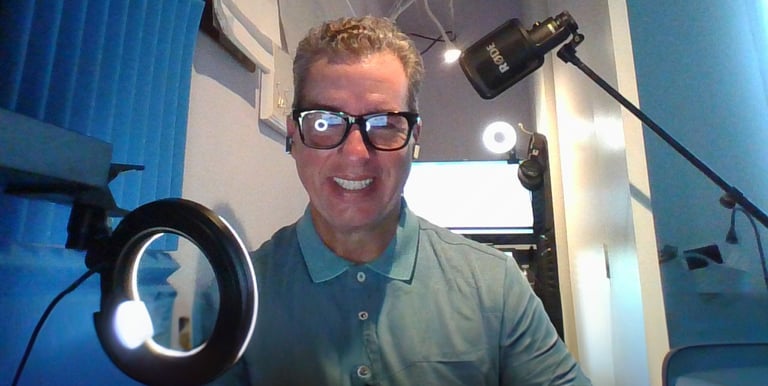 Eric DeRise, a dynamic Instructional Designer and Video Producer working in his studio.