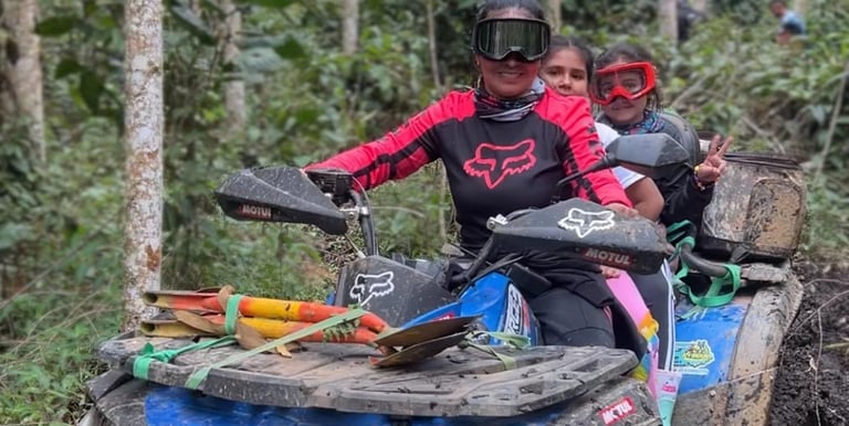 a man and a woman riding on a four wheeler atv