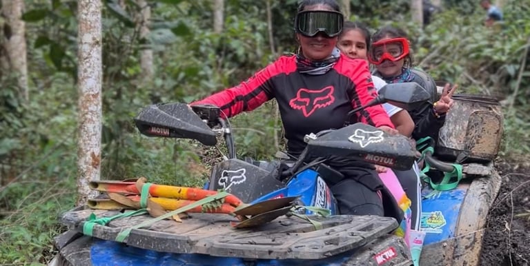 a man and a woman riding on a four wheeler atv