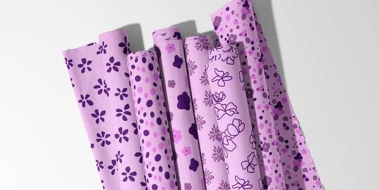 Rolled fabric with intricate floral seamless patterns, ready for licensing.