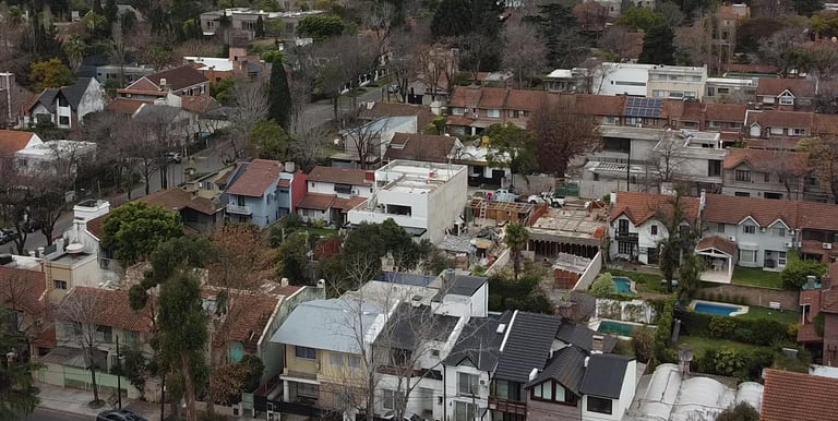 a city street scene with a clock tower in the distance