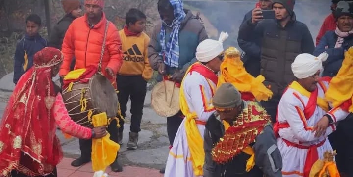 Traditional folk dancers and musicians in colorful attire