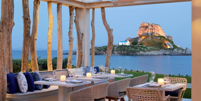 Ouzo outdoor restaurant over looking the sea at Ikos Aria  