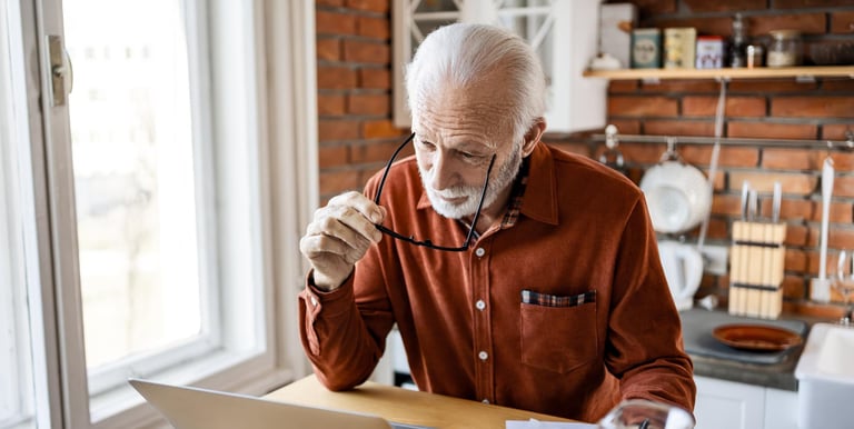 Retired Western professional reviewing retirement planning documents abroad