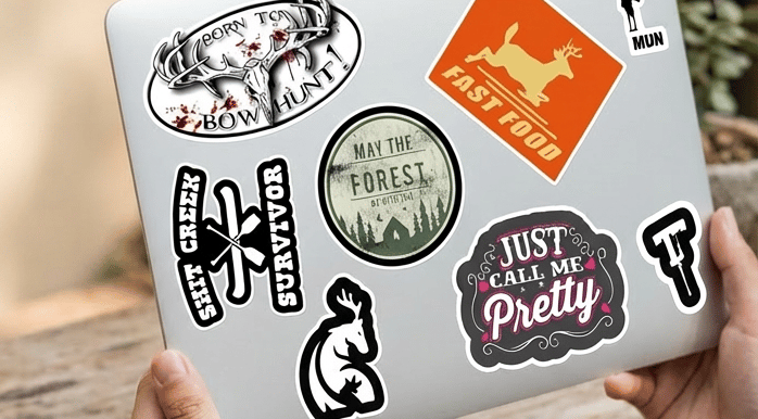 laptop with stickers on it