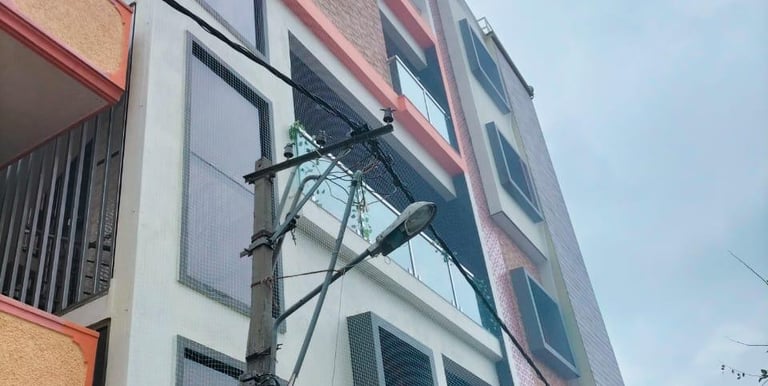 Close-up of a sturdy anti-pigeon safety net installed on a Pune balcony.
