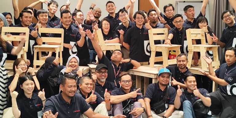 Participants just completed making classroom table and chairs which will be donated to a school