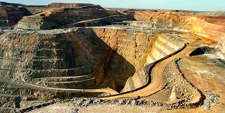 a large open pit hole in a large open pit