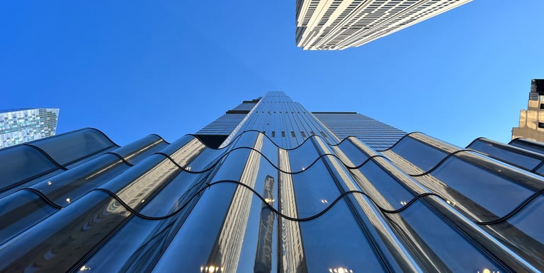 a tall building with a very tall building in the background