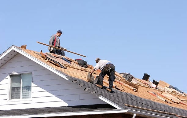 Roofers working on a roof