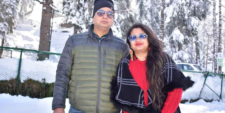 a couple on there kashmir trip posing in snow